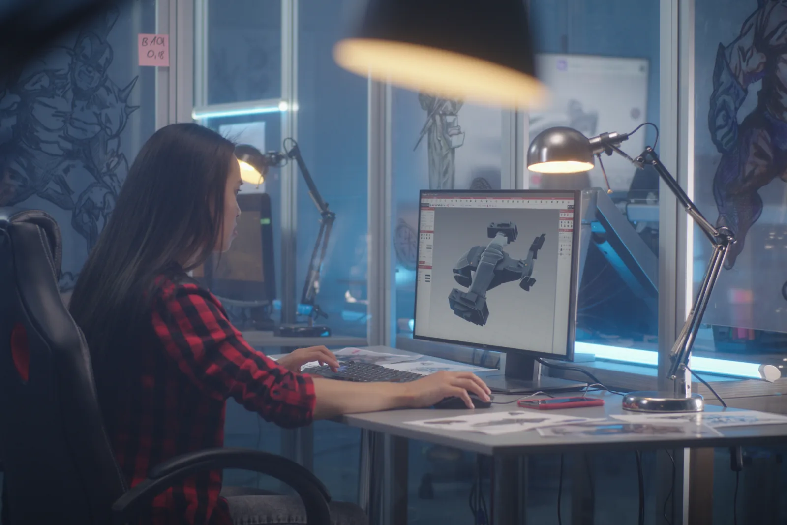 Designer developing a mechanical assembly in 3D CAD